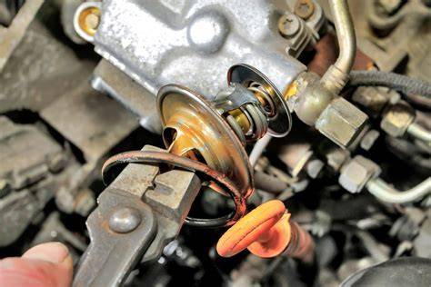 Umiestnenie termostatu na motore Peugeot 306