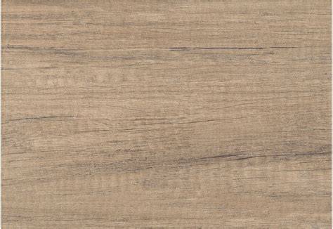 Detail lesklého keramického obkladu Pinia Brown 25x36
