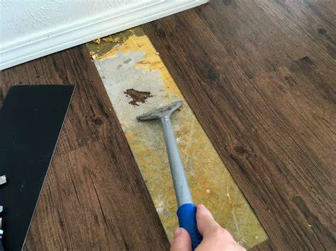 Steps for repairing glued vinyl floor